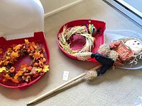 Overview of both wreaths, scarecrow stake, plush turkey and two red storage bins