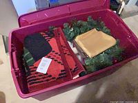 Overview of tote showing holiday throw, gold fabric, and wreaths