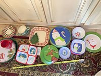 Group view of all holiday dinnerware pieces on floor