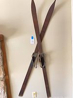 Full view of crossed wooden skis mounted on wall