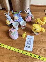 Group shot of all nine Easter decor items with measuring tape for scale
