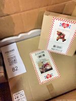 Two Eddie Walker boxed ornaments and additional boxed contents in carton