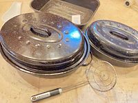 Roaster with two lids and KitchenAid skimmer visible