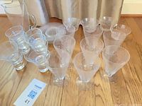 Group view of pitcher, stirrer, tumblers and stemware