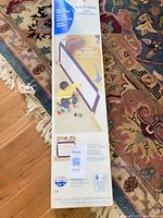 Front of Evenflo Soft 'n Wide gate box showing product image and specifications