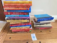 Overall view: stack of hardcovers and stack of spiral-bound books