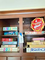 Shelf view showing Yamslam, Othello, Sequence, LIFE boxes