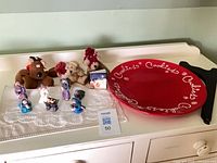 Group shot showing plate, stand, nativity figurines, plush toys
