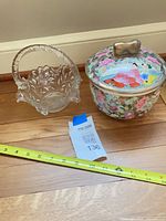 Overall view of porcelain jar and glass basket side by side