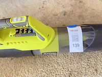 Handle and body of Ryobi blower with MaxSold sticker visible
