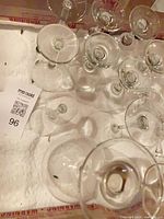 Top view showing multiple clear glass stems in packing box