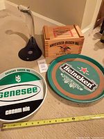 Group shot of all items: two trays, wood crate, metal stand with measuring tape for scale