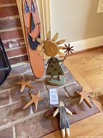 Entire lot showing sun figurine, pumpkin accent and three stars