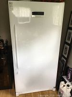 Front view of closed white freezer