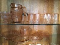 Overall shelving display of all pink depression glass pieces
