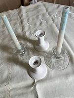 Top view showing two ceramic and one glass holder with candles