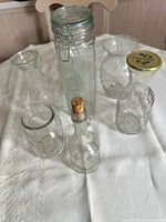All six clear glass vessels grouping