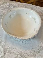 Top view of entire bowl showing interior floral decals and scalloped rim
