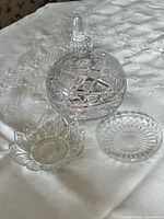 Top view of covered candy bowl, small bowl and flat dish