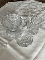 Pedestal bowl, tumbler/vase and shallow dish grouped on table