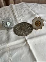 Group shot of both Lenox clocks and glass trivet