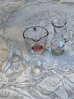 All four glass items grouped on table