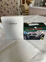 Showbox scanner box beside Nikon One Touch 100 camera box