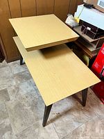 Top and legs of two-tier side table