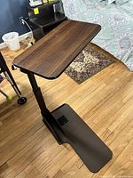 Height-adjustable tray table angled view