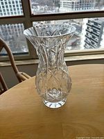 full side view of clear cut glass vase showing pattern and flared rim