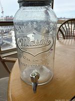 Front view showing embossed wording and spigot