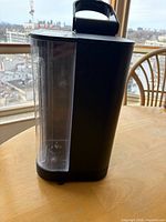 Side view displaying clear removable water reservoir