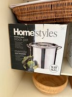 Box of Homestyles stainless steel stock pot showing product image, brand and capacity