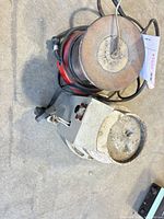 Both solder pots showing shapes, crucibles, cords, surface wear