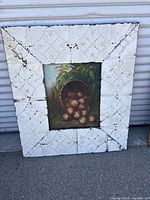 Full view painting with pressed-tin frame