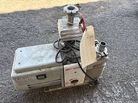 Overall view of Edwards No. 5 vacuum pump with ports and power cord
