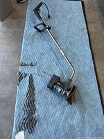 Full view of Pacific Steamex floor scrubber lying on a quilted moving blanket