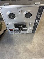 Front view of Sony TC-630 reel-to-reel tape recorder showing reels area, control panel, meters and buttons