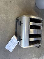 Top view showing four slots, levers, knobs and stainless body