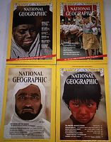 Four National Geographic covers displayed
