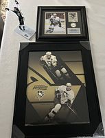 Group shot of poster, framed display and figurine