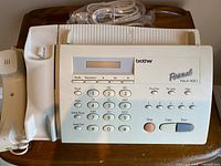 Top view of Brother Personal Fax 190 showing keypad, LCD, handset and wrapped telephone cord
