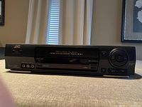 Front view of JVC HR-VP673U VCR showing Pro-Cision 19u head labeling and front controls