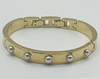 Front view showing pearls and clasp