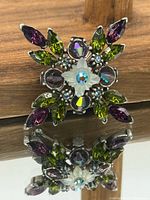 Front view of multicolour rhinestone brooch