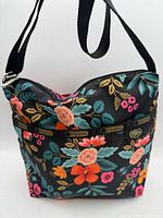 Front view of floral LeSportsac crossbody showing print, pockets, strap