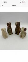 Front view of four onyx dog figurines