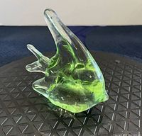 Side view showing clear glass body with green core