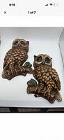 Front view of both owl plaques side by side