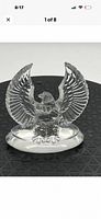 front view of clear crystal bald eagle on oval base